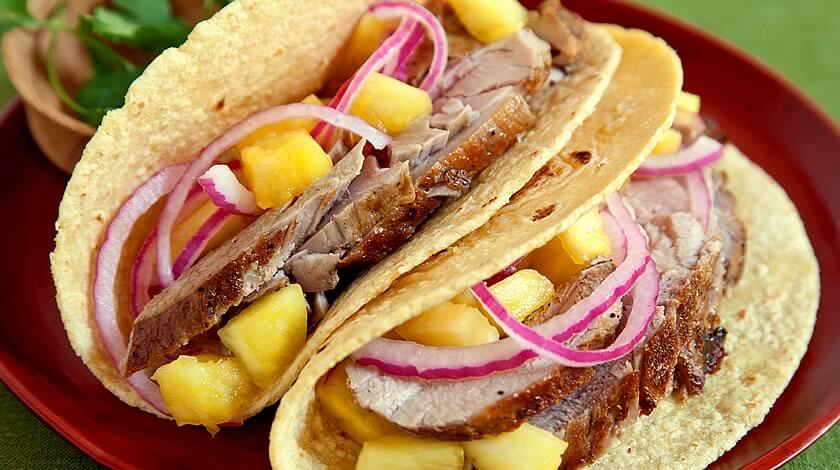 Jalapeño Pork Tacos with Pineapple Salsa and Pickled Onion