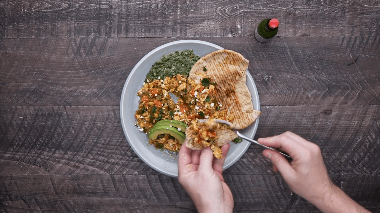 Turkish Scrambled Eggs on Toasted Seeded Pita with Salsa Verde and Cilantro