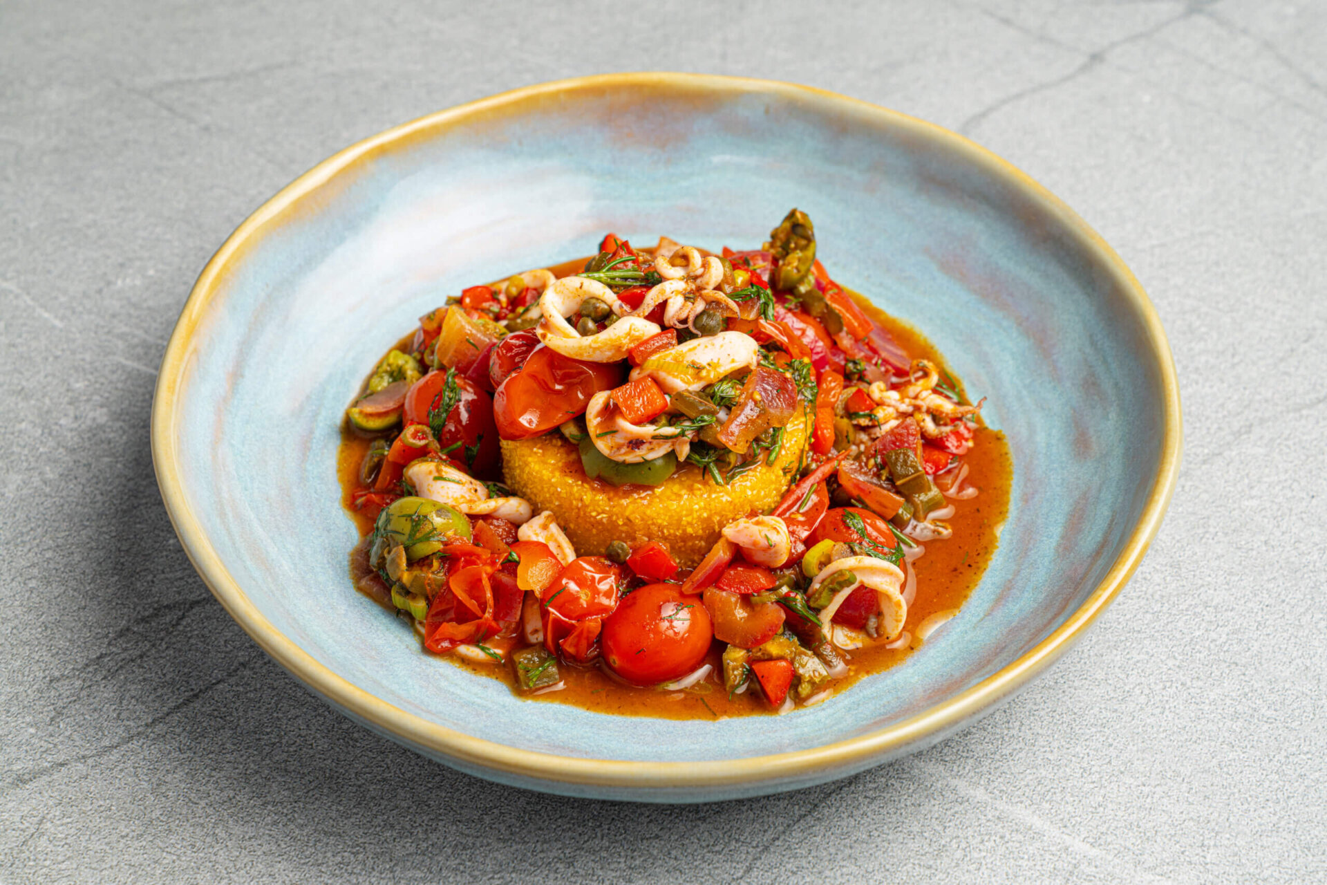 Calamari Puttanesca with Fried Polenta​